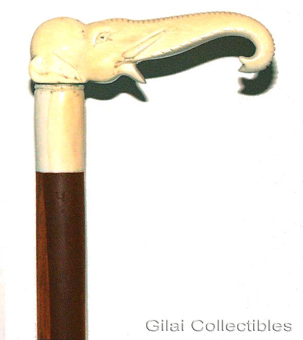 A 19th Century Ivory Handled Walking Stick With Cylindrical Ivory Collar And Makassar Ebony Shaft. - click to enlarge.