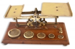 Brass Postal Scales with 7 weights on a Mahogany Base