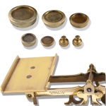 Brass Postal Scales with 7 weights on a Mahogany Base - click to enlarge.
