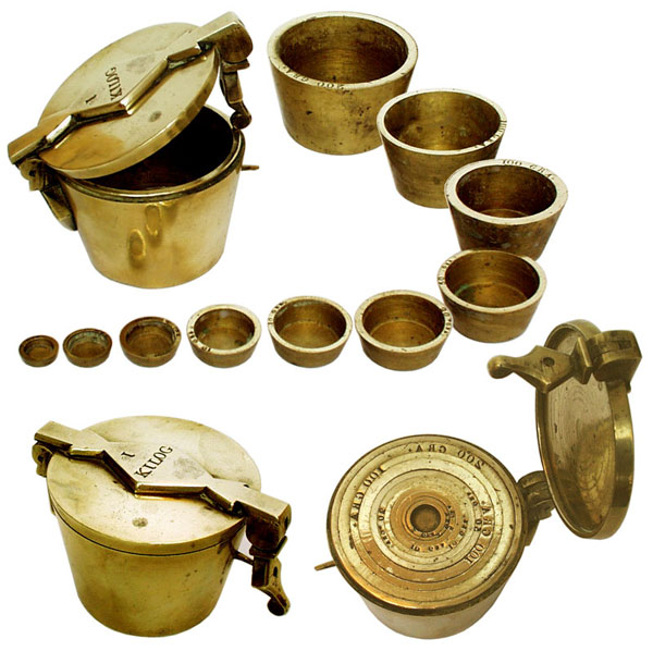 A Rare 19th Century French Set of Nested Brass Cup-Shaped Metric Weights. - click to enlarge.