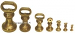 Set of 7 English Brass Bell Shaped Weights. - click to enlarge.